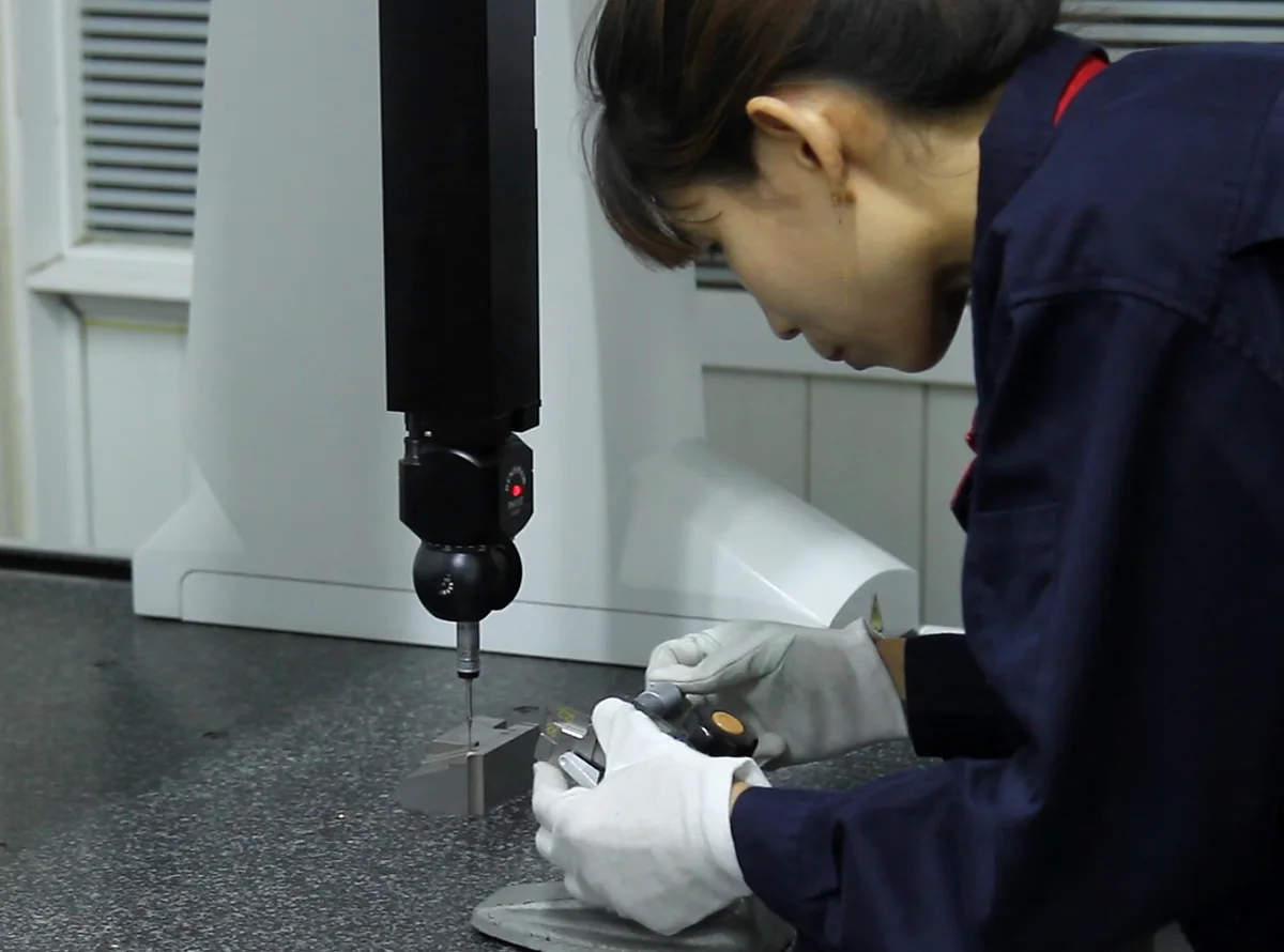 RIXIN quality technician performing dimensional inspection