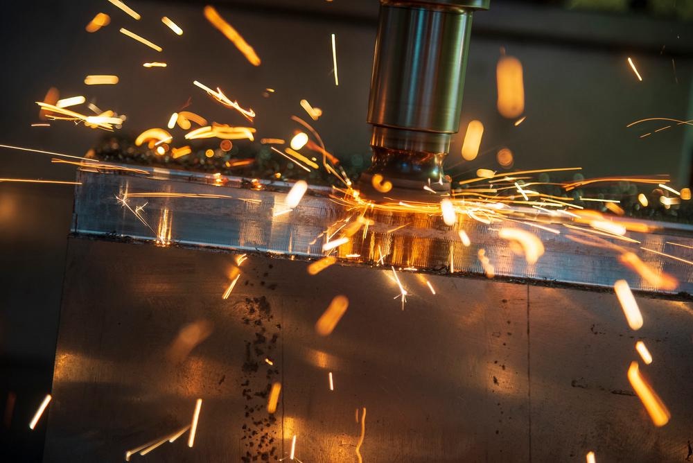 CNC machining tool cutting metal with sparks